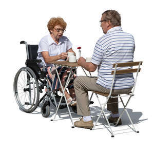elderly couple sitting in a cafe