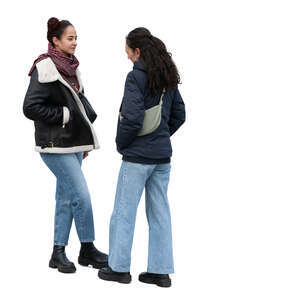 two dark haired women talking in autumn