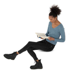 top view of a young black woman sitting and reading a book