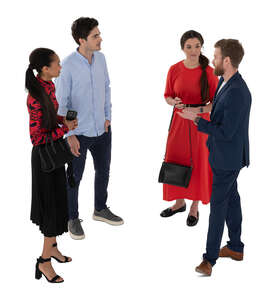 top view of two couples standing and talking at a party