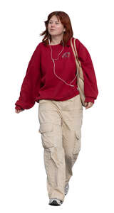 teenage girl walking and listening to music