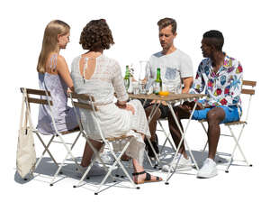 group of friends sitting in an outdoor restaurant