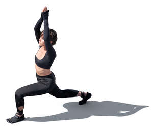 cut out backlit woman doing yoga seen from above