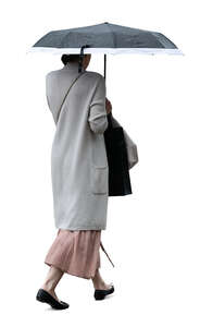 cut out woman with an umbrella walking