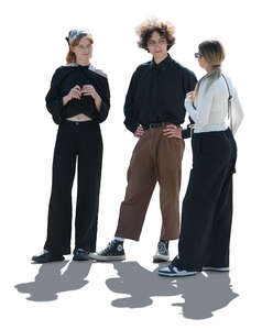 cut out backlit group of three young people standing