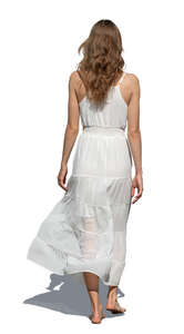 woman in a white dress walking barefoot