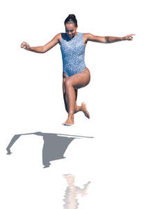 woman jumping into the pool