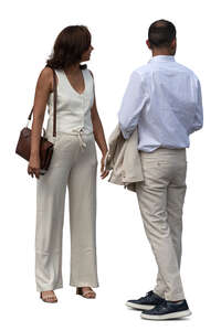 two people in summer suits standing and looking