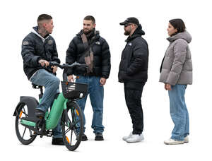 group of people standing in the street and talking