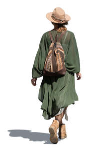 bohemian woman with a hat walking