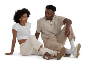 black couple sitting on the ground