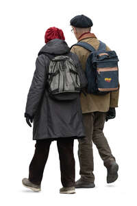 older couple walking arm in arm in autumn
