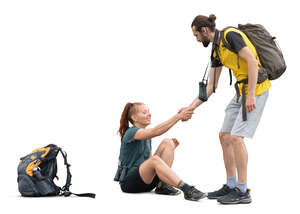 cut out hiker helping a woman to stand up