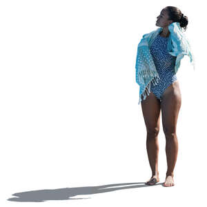cut out backlit woman in a swimsuit drying herself