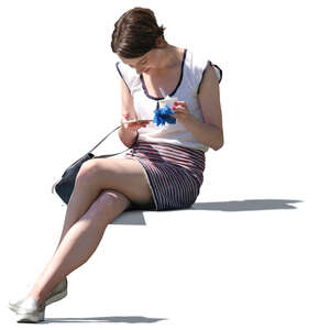 woman sitting and eating ice cream