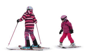 two cut out girls mountain skiing