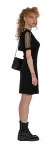 cut out curly haired woman in a dress standing