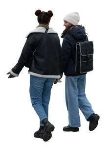 two young women walking in winter