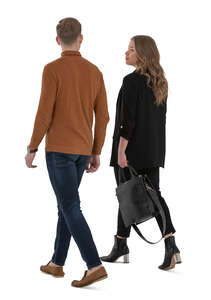 man and woman walking seen from back angle