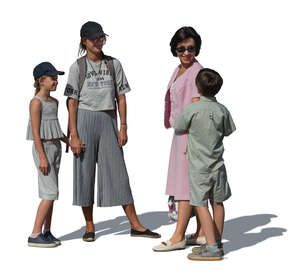 two women with kids standing and talking