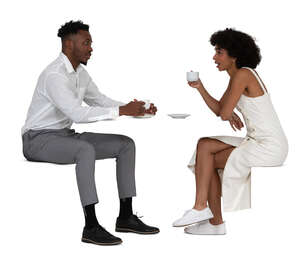 black man and woman sitting in a restaurant and talking