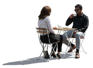 backlit cafe scene with two people drinking coffee