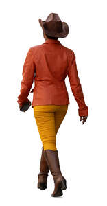woman with a cowboy hat and boots walking