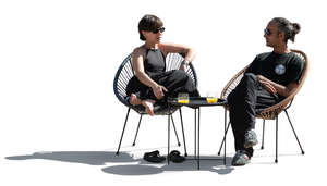 cut out backlit scene of two people sitting on the patio