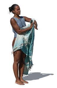 cut out black woman drying herself after swimming