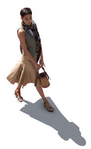 top view of a backlit woman walking