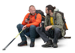 two cut out hikers sitting and drinking tea