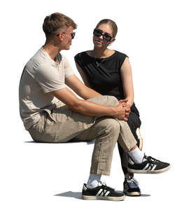 two cut out people sitting and talking