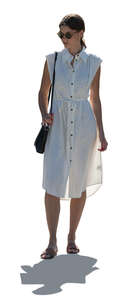 cut out woman in a white dress standing in backlight
