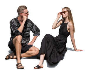 man and woman sitting outside in summer and talking
