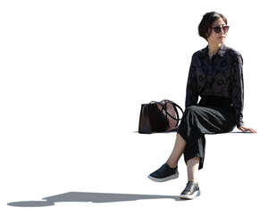 cut out backlit asian woman sitting