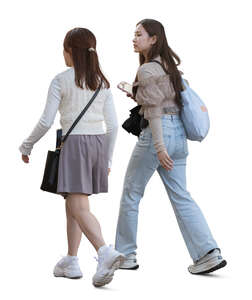 two cut out young asian women walking