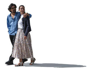 cut out sidelit couple walking