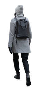 cut out asian woman in a grey winter coat walking