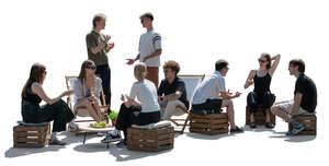 cut out backlit scene of people hanging and relaxing outside