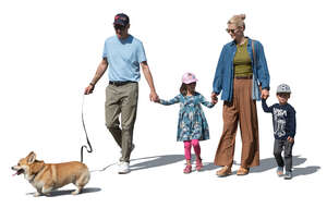 cut out family with kids and a dog walking hand in hand
