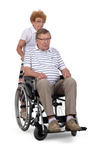 cut out elderly woman caring for a man in a wheelchair