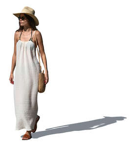 woman with a hat and summer dress walking