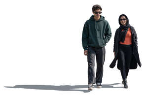 middle eastern man and woman walking