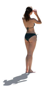 cut out backlit woman in a bikini standing