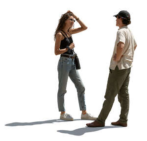 two people standing and talking in backlight