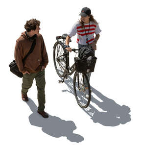 top view of two people walking in backlight