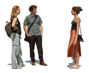 group of friends standing outside in summer and talking