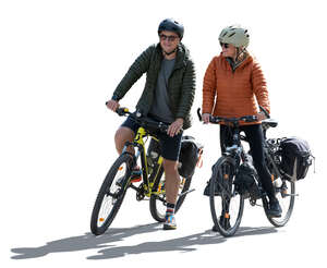 two people with travel bikes stopping in backlight
