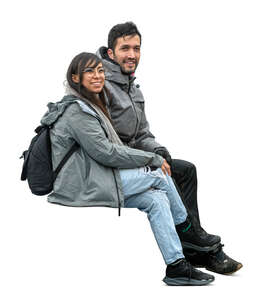 man and woman in grey autumn jackets sitting together