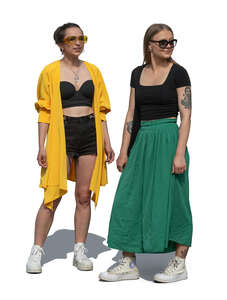 two women standing and looking at smth